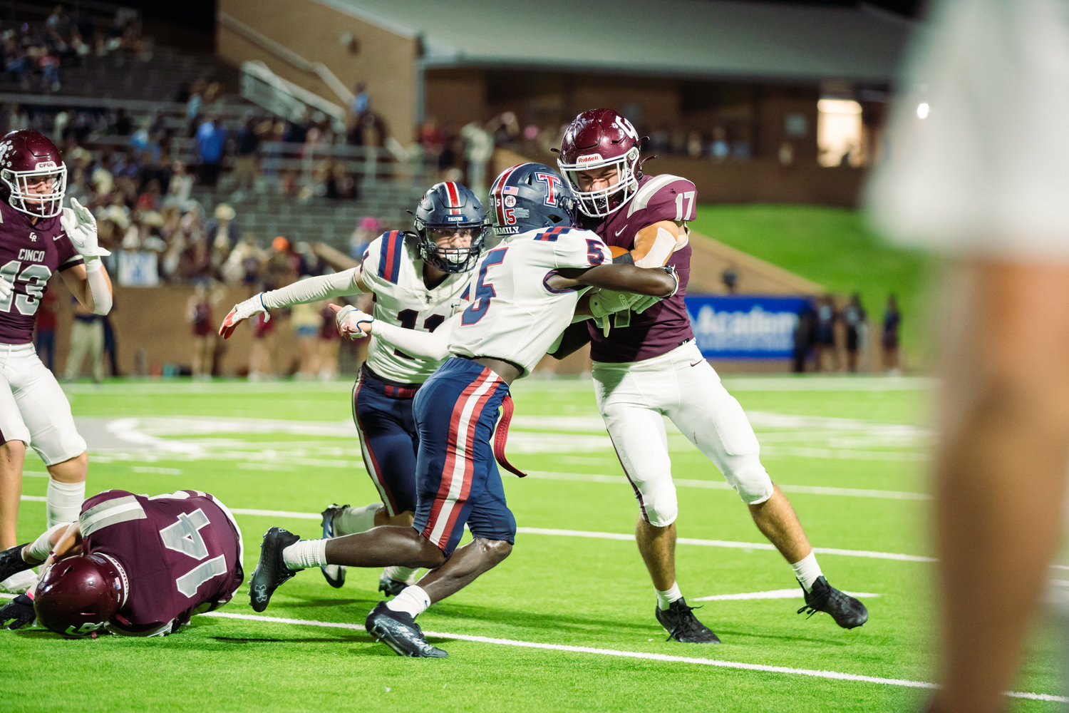 Cinco Ranch’s Eric Eckstrom fights for yardage during Friday’s game between Cinco Ranch and Tompkins at Rhodes Stadium.